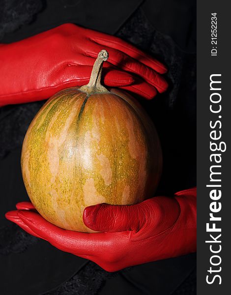 Woman holding halloween dramatic magic pumpkin. Woman holding halloween dramatic magic pumpkin