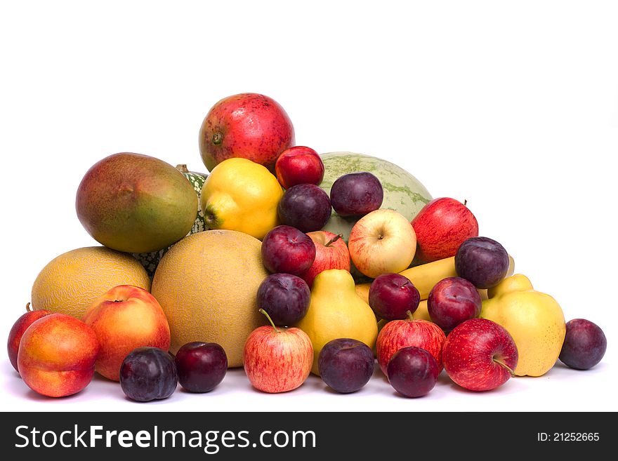 Close up view of a pile of fresh variety of fruits isolated on a white background. Close up view of a pile of fresh variety of fruits isolated on a white background.