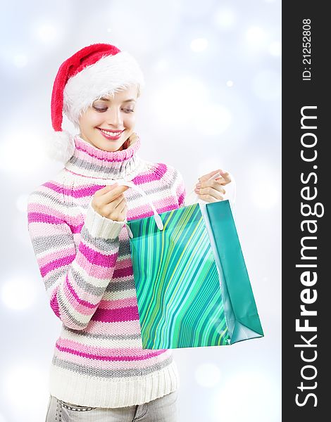 Santa girl holding shopping bag