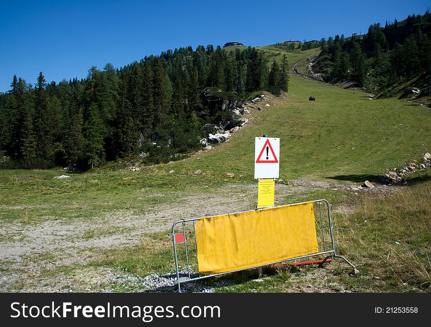 A green ski piste in summer in the mountains of Austria. A green ski piste in summer in the mountains of Austria
