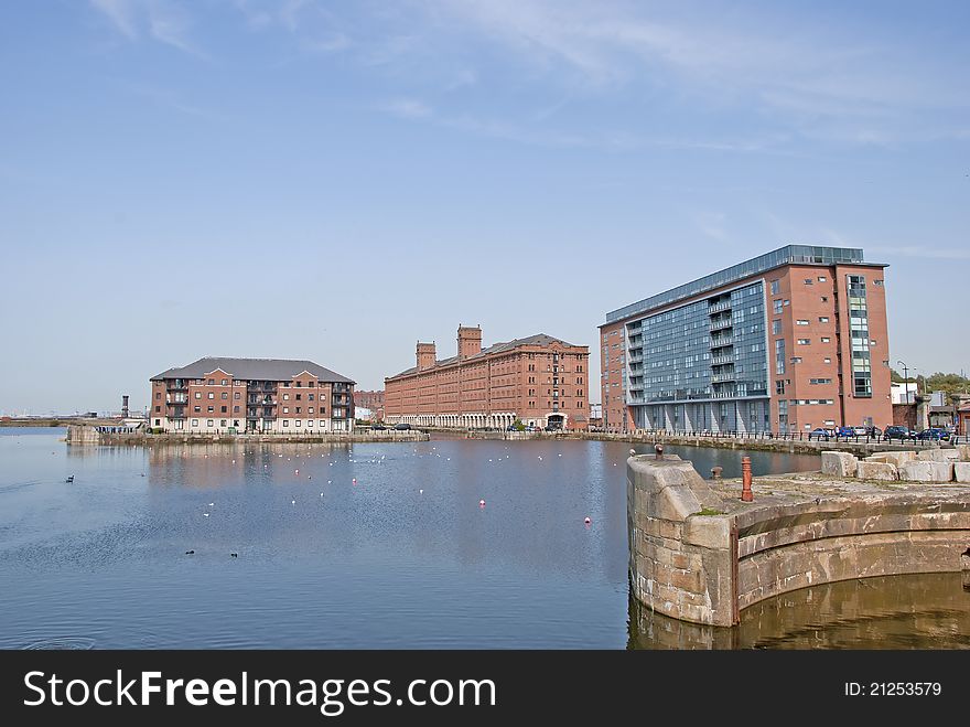 A Dock Redevelopment with Red Brick Apartments in an English City. A Dock Redevelopment with Red Brick Apartments in an English City