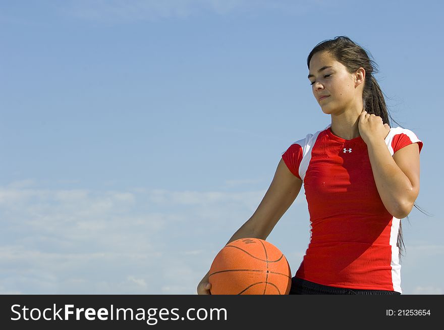 Attractive Female Holding A Basketball