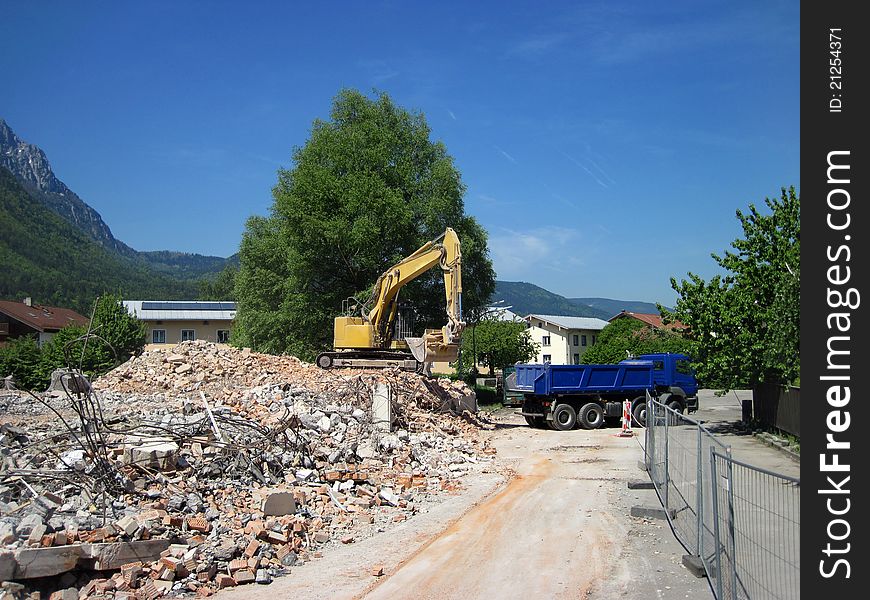 Demolition, construction. Crane dismantling building.