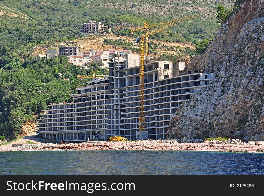 Modern hotel under construction, on the Adriatic Sea coast, between mountains. Modern hotel under construction, on the Adriatic Sea coast, between mountains