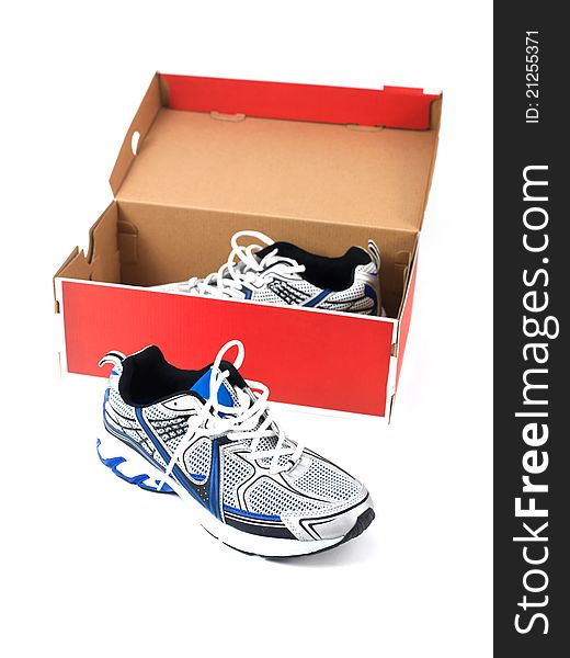 Sports runners situated in a shoe box