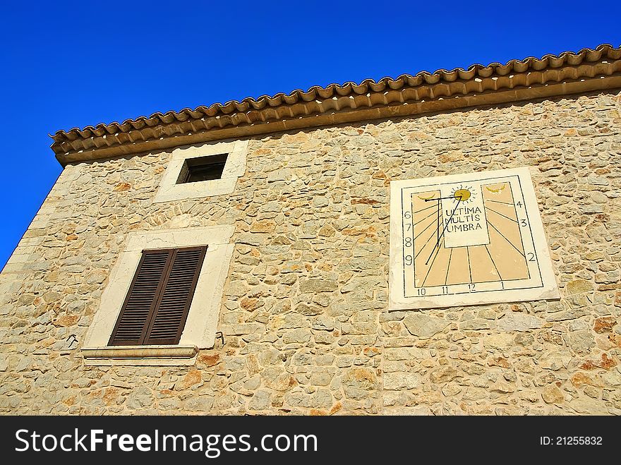 Mediterranean rural House in Majorca (Spain) with a solar clock on the facade