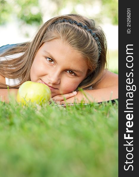 Portrait of little girl with green apple outdoor. Portrait of little girl with green apple outdoor