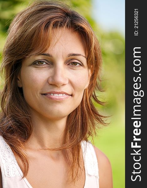 Close up portrait of beautiful caucasian woman in park. Close up portrait of beautiful caucasian woman in park