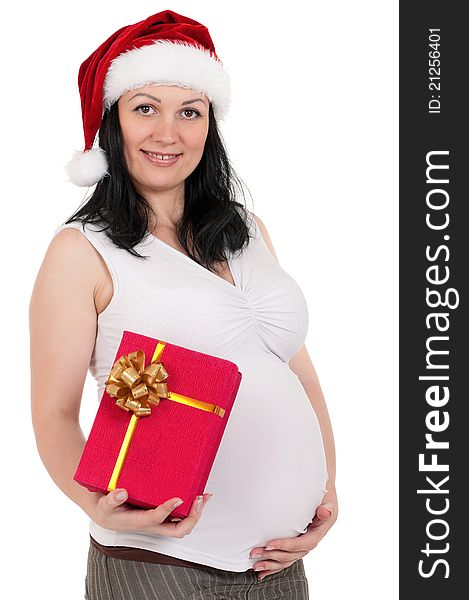 Portrait of a pregnant woman in santa hat with gift box over white background. Third trimester. Portrait of a pregnant woman in santa hat with gift box over white background. Third trimester.