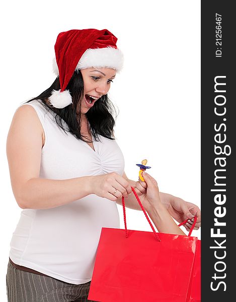 Portrait of a pregnant woman in santa hat holding a shopping bags over white background. Portrait of a pregnant woman in santa hat holding a shopping bags over white background