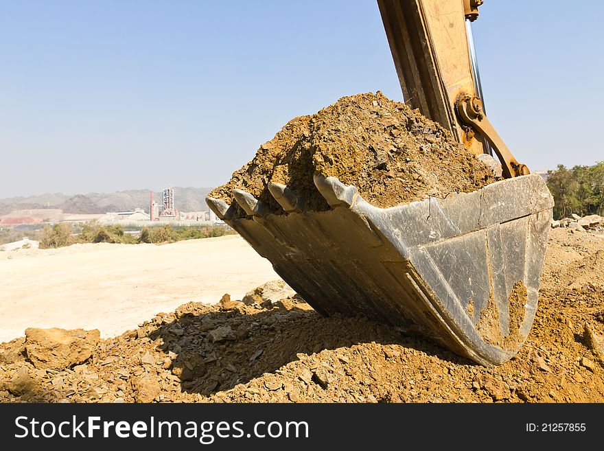 Excavator loader during Earth moving works outdoors  at the quarry