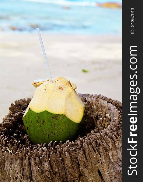 Fresh coconut juice with drinking straw