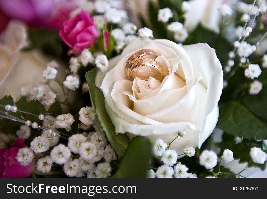 Wedding bouquet and Wedding rings. Wedding bouquet and Wedding rings