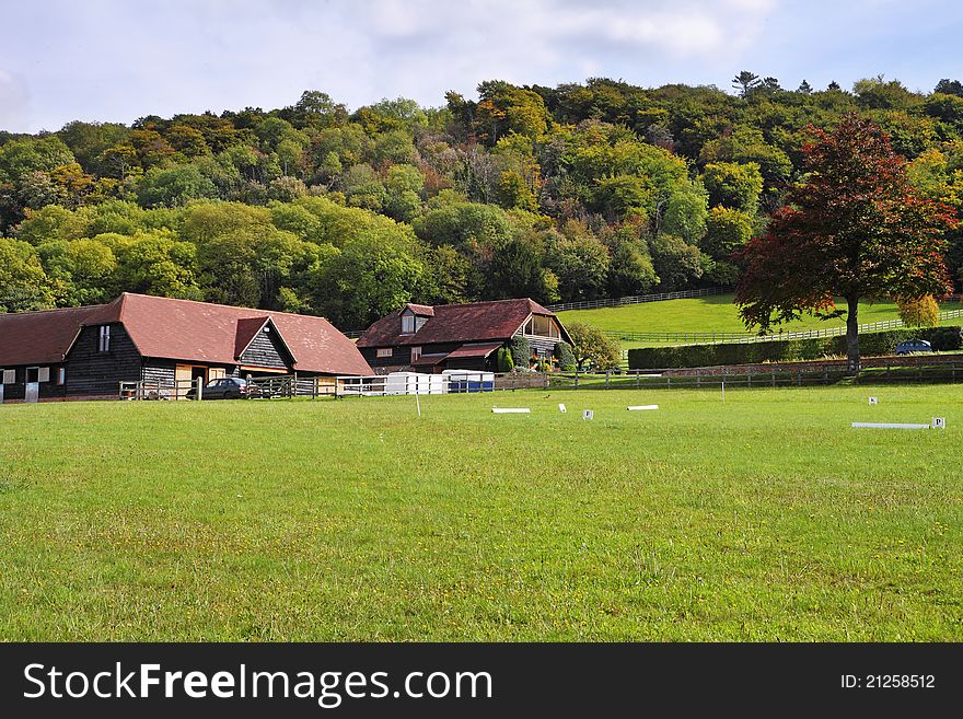 An English Rural Landscape in the Chiltern Hills in early autumn with Farm and woodland. An English Rural Landscape in the Chiltern Hills in early autumn with Farm and woodland