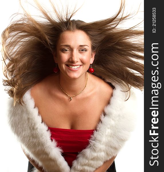 Beautifuleuropean woman in red dress with furs against white backgrounds