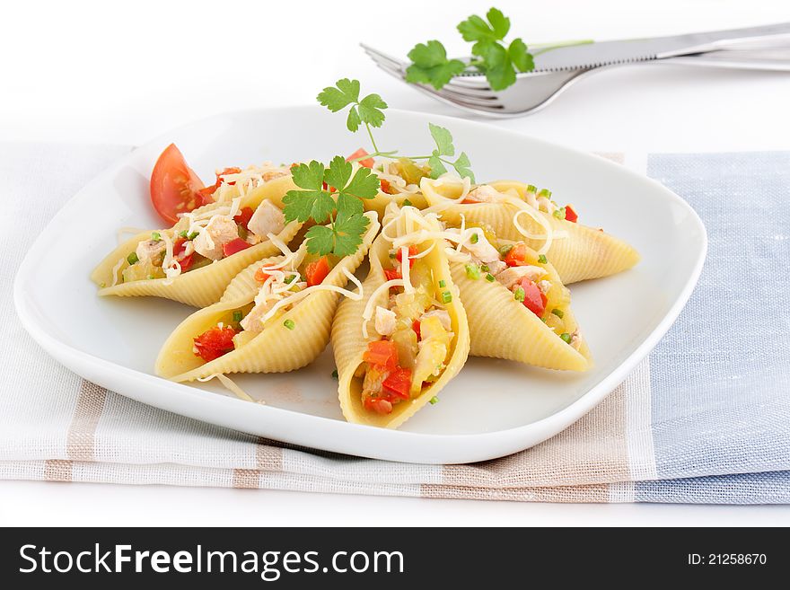 Stuffed conchiglioni with chicken. pepper, celery and cheese