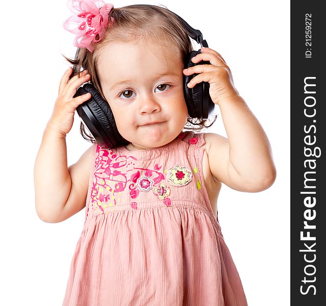 Little girl with headphones. Isolated on white background