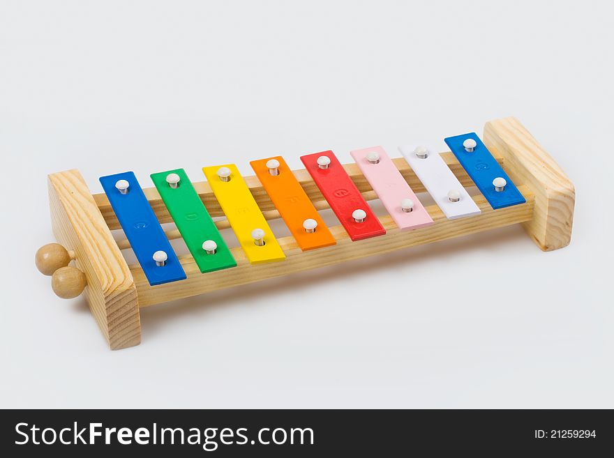 Wooden xylophone on a white background