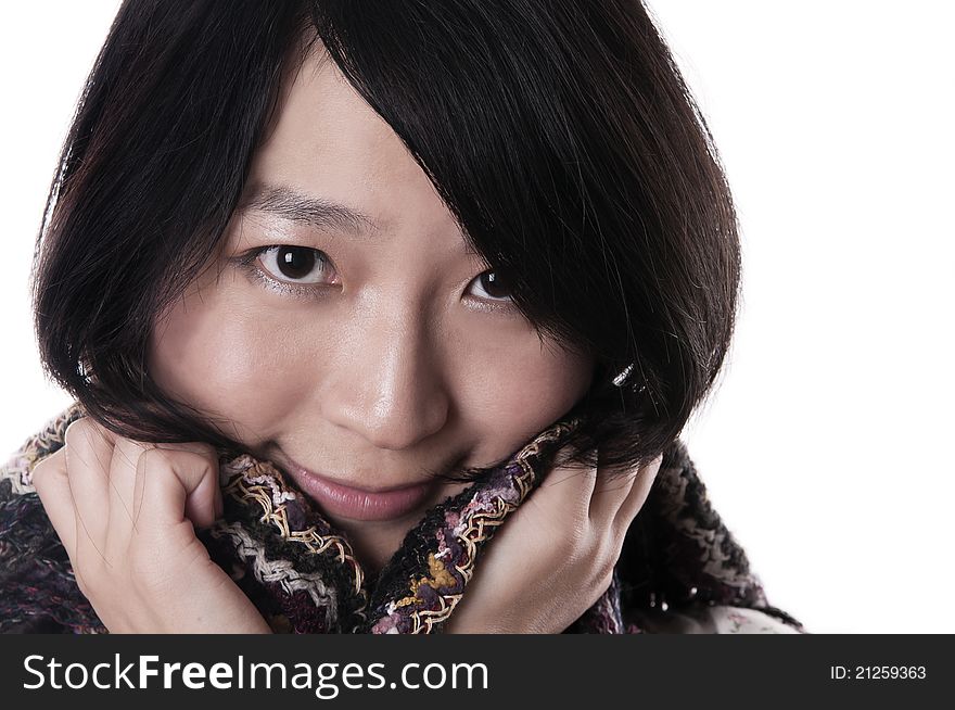 Young asian woman wearing a shawl on white. Young asian woman wearing a shawl on white