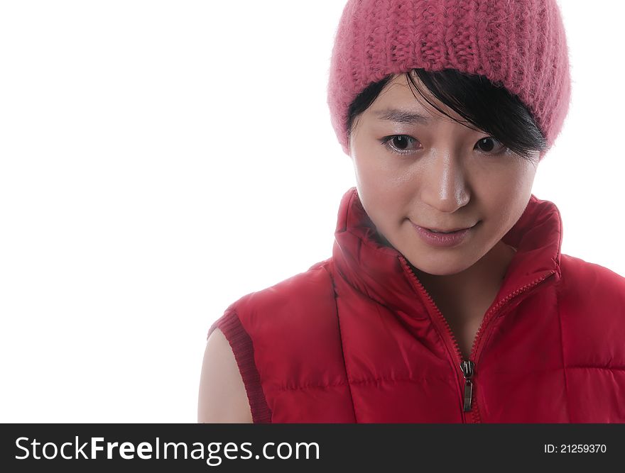 Pretty young asian woman with a red winter jacket and a nice red cap. Pretty young asian woman with a red winter jacket and a nice red cap