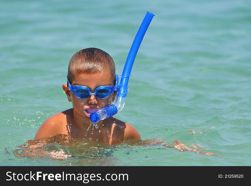 Boy in the water with diving equipmant,water sport. Boy in the water with diving equipmant,water sport