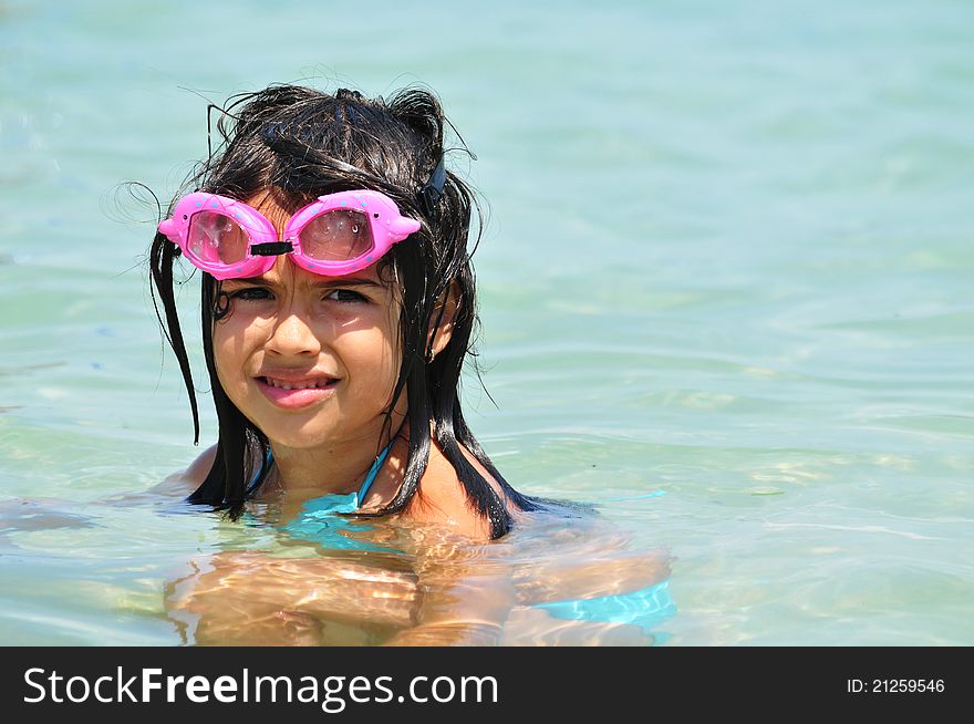 Girl with glasses in the water for swimming, protection