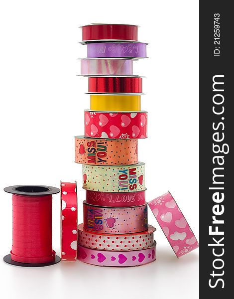 Stack of colorful ribbon collection on white background. Stack of colorful ribbon collection on white background