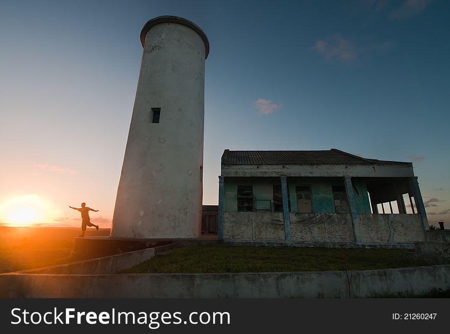 View of someone next to a lighthouse during sunset, Mozambique