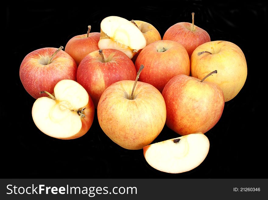 Fresh red apples isolated over black background