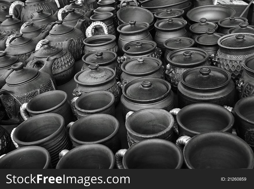 Pottery: the black-and-white photo is a lot of pots, mugs and the cups located on one surface,. Pottery: the black-and-white photo is a lot of pots, mugs and the cups located on one surface,