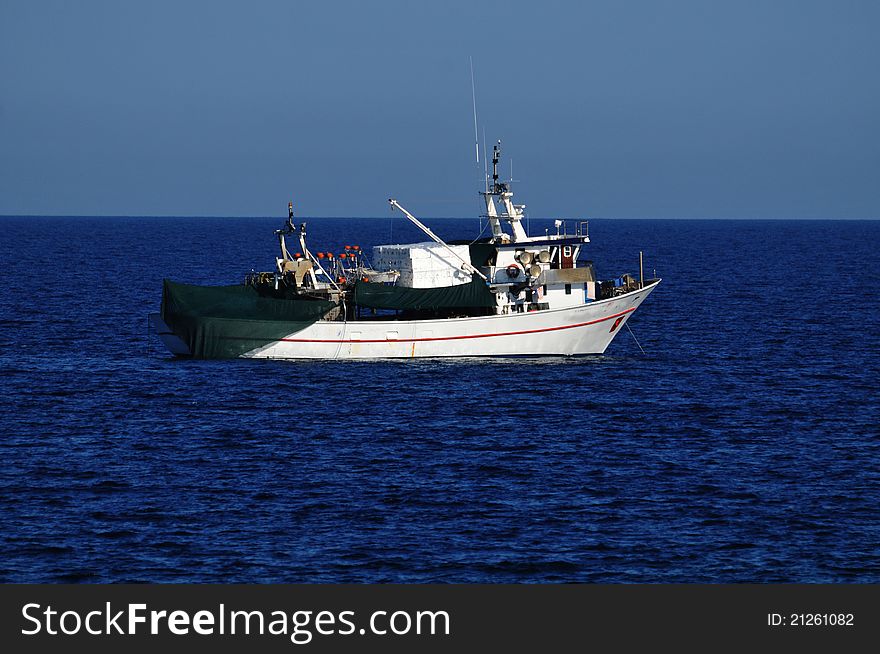 Fishing boat at sea,hard work