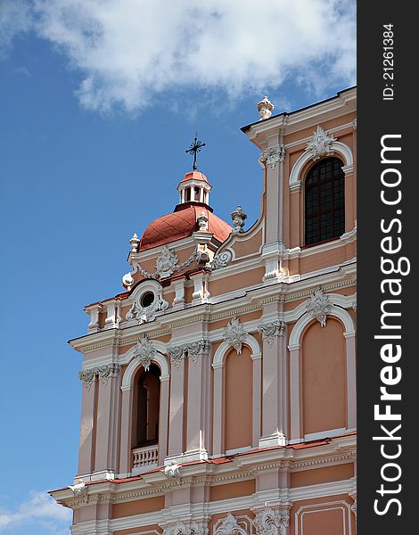 Fragment of Catholic Church in baroque style with great number architectural details and embellishments. Vilnius, Lithuania. Fragment of Catholic Church in baroque style with great number architectural details and embellishments. Vilnius, Lithuania.