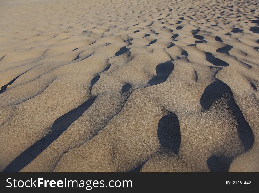 Detail of lines windward in sand dune, background, texture