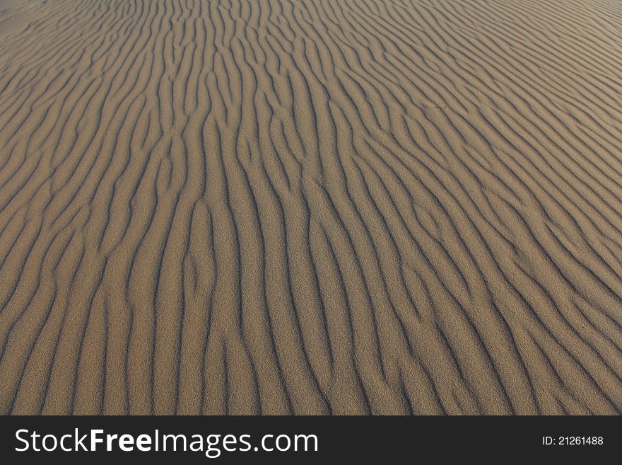 Detail of lines in sand dune, background