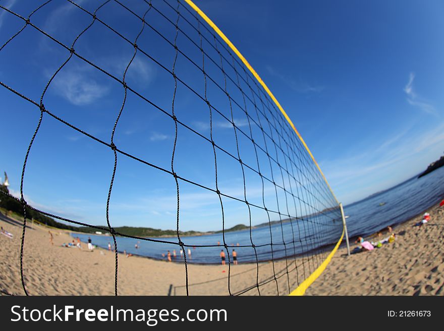 Volleyball net on a sandy beach, detail with fisheye