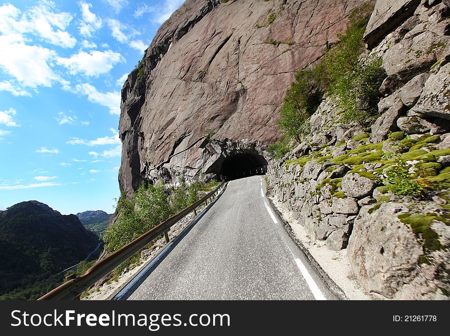 Tunnel cut into mountain, road pass in Scandinavia