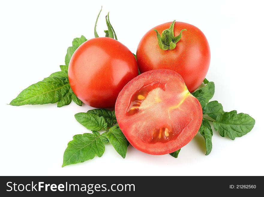 Ripe red tomato with leaf