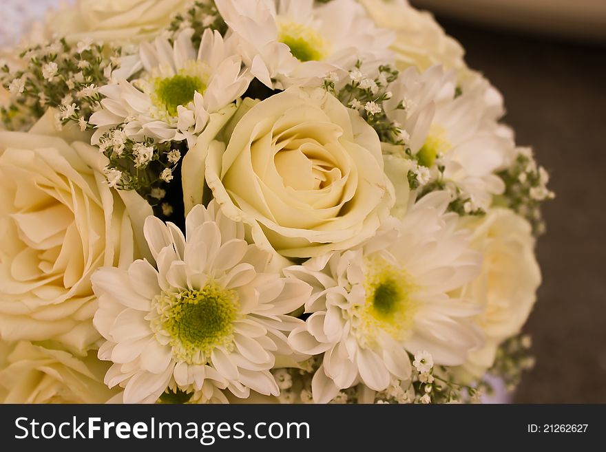 Wedding bouquet from roses and chrysanthemums