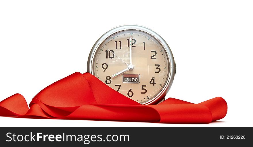 Alarm-clock with red ribbon on white