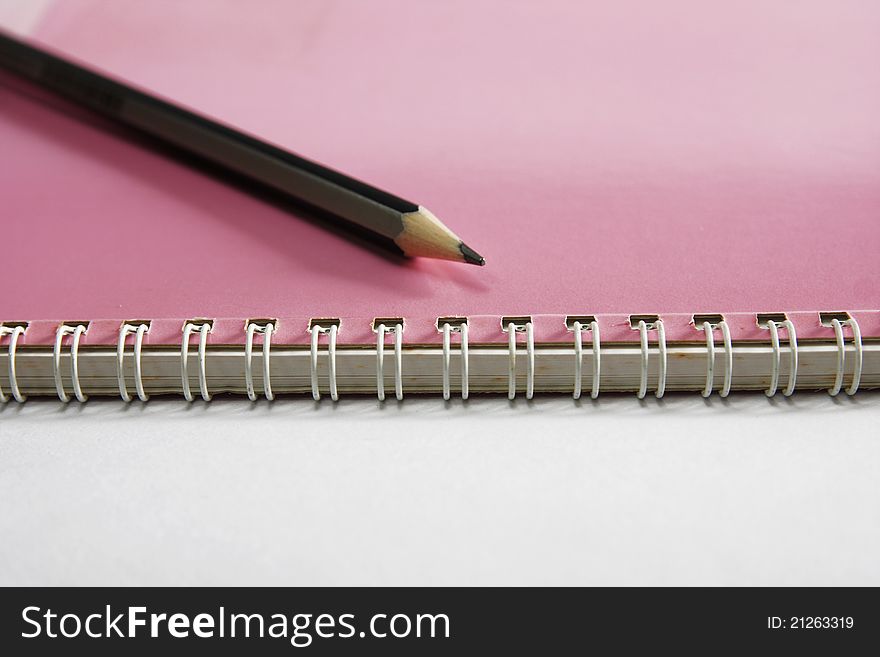 Notebook on the white with pencils. Notebook on the white with pencils.