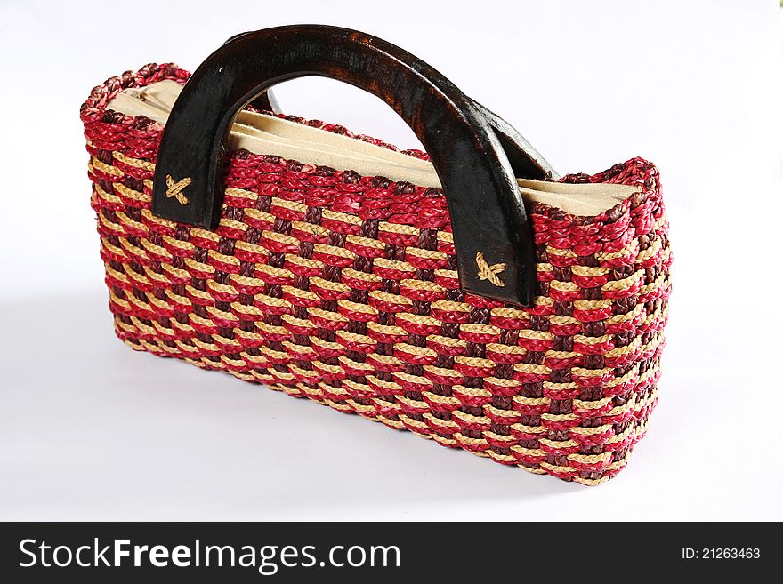 Wicker bag on the white background