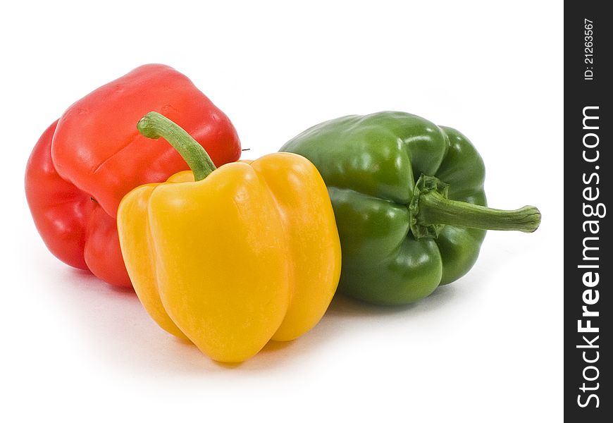 Paprika red, green, yellow  on a white background. Paprika red, green, yellow  on a white background