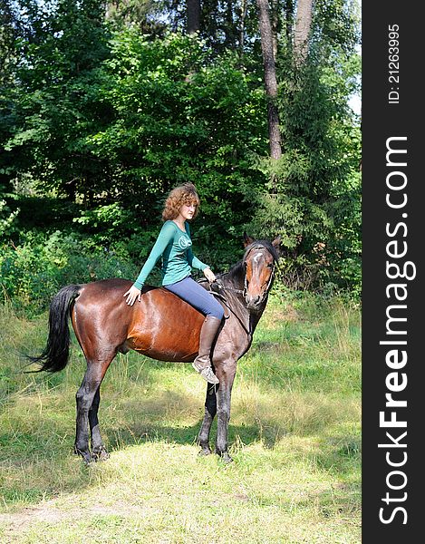 Girl siiting on horseback without saddle. Girl siiting on horseback without saddle