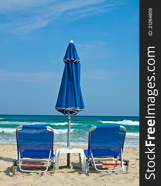 Sunbeds and umbrella at Paradise Beach Thasos