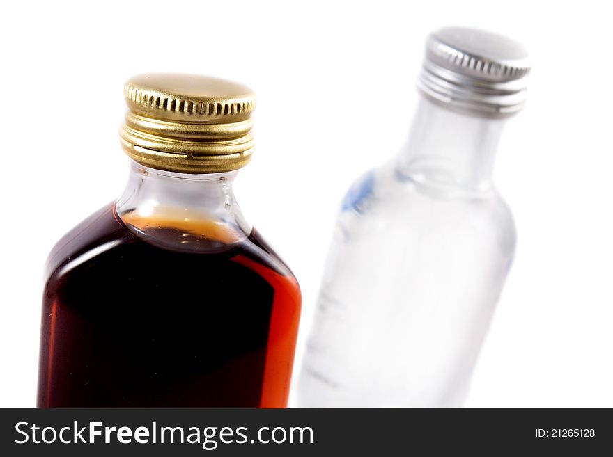 Two bottles on a white background