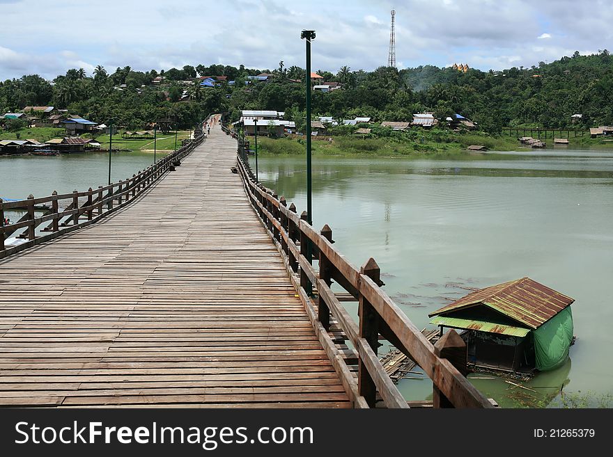 Wooden bridge and floating raft house in Sangklaburi, Thailand