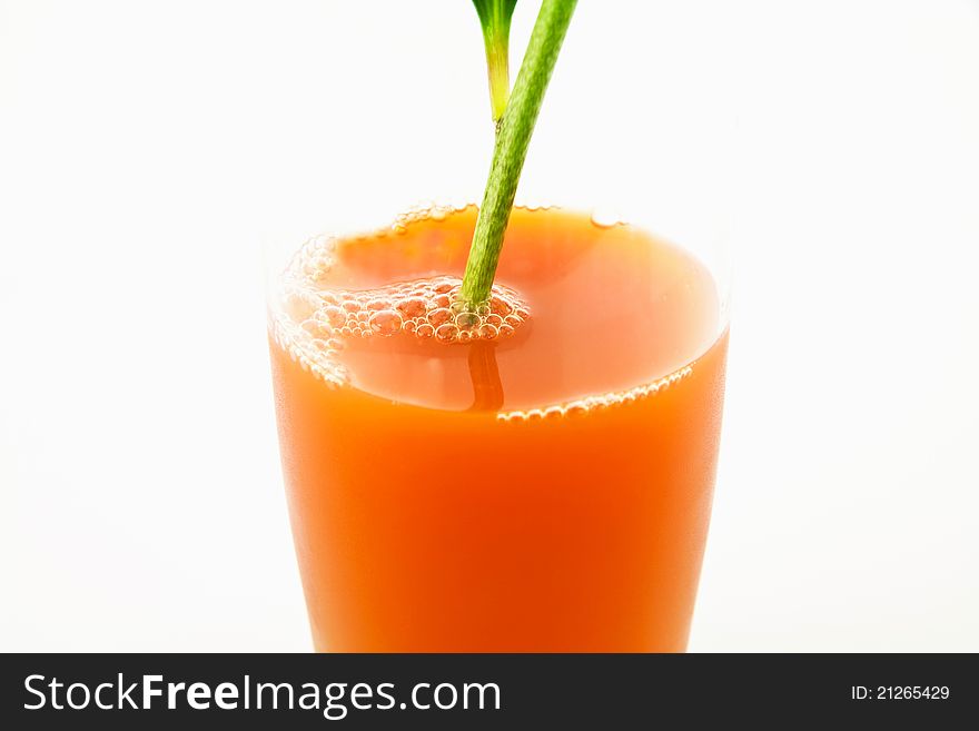 Branch of flower in glass of juice. Branch of flower in glass of juice