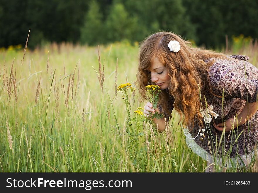 Beautiful pregnant girl on the field