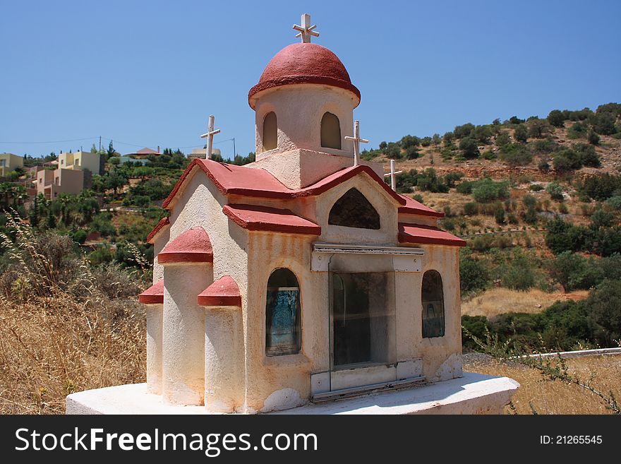 Classic Greek wayside shrine in the village in Crete