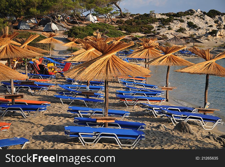 Umbrellas and deck chairs on the sandy beach